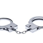 Photo of a pair of handcuffs isolated on a white background