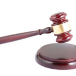 Wooden gavel on white background