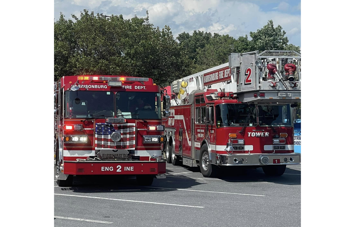 Two Harrisonburg Fire Department firetrucks in a parking lot