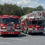 Two Harrisonburg Fire Department firetrucks in a parking lot