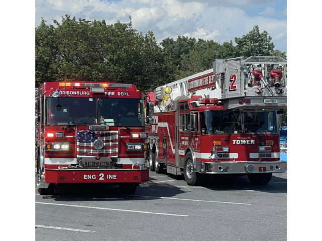 Two Harrisonburg Fire Department firetrucks in a parking lot