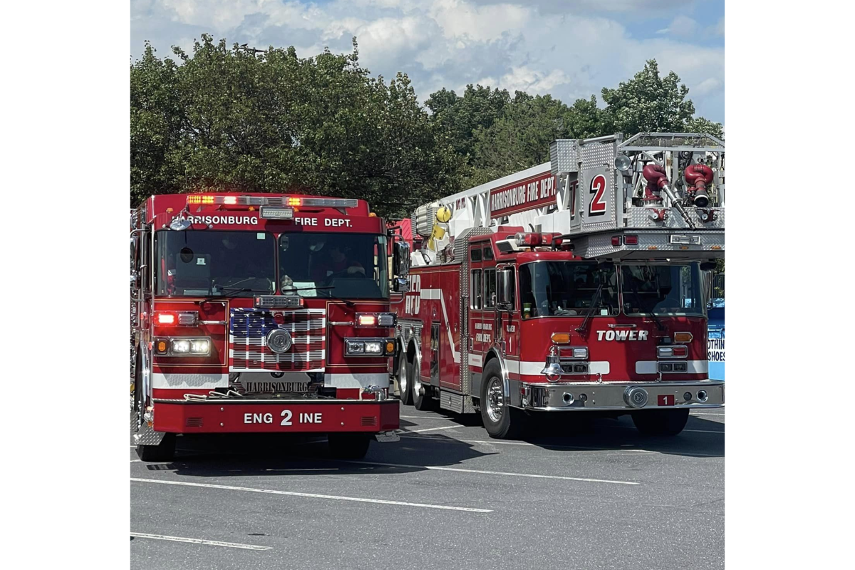 Two Harrisonburg Fire Department firetrucks in a parking lot