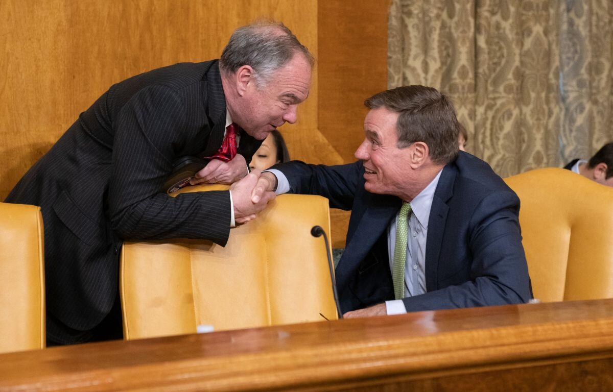 Senators Kaine and Warner shaking hands