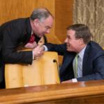 Senators Kaine and Warner shaking hands