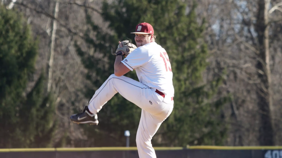 The Bridgewater College Baseball pitcher winds up his throw.