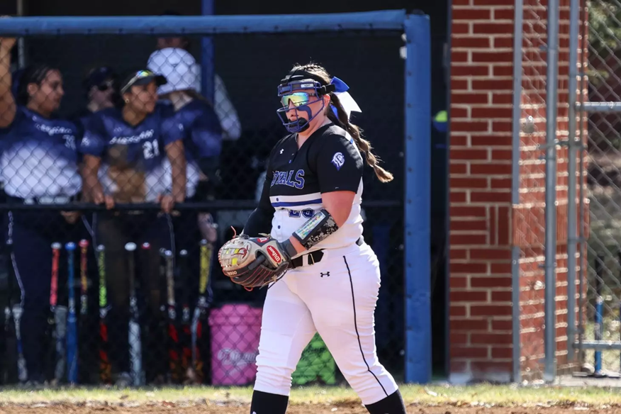 Eastern Mennonite Softball player Natalye Graham gets ready to throw a softball.
