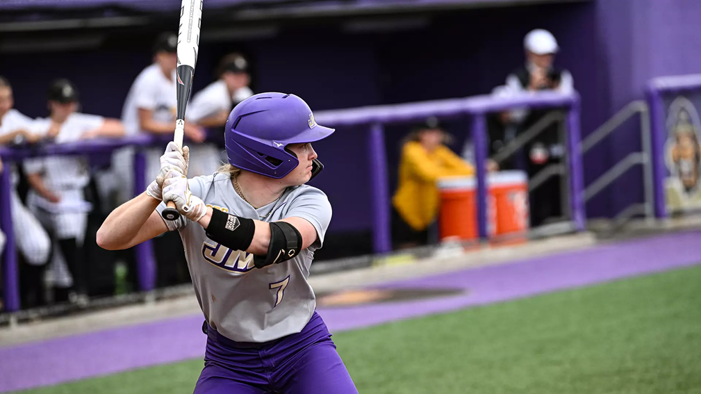James Madison University softball player Jasmine Hall gets ready to swing at a softball.