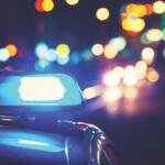 A photo of a blue light on top of a police vehicle.