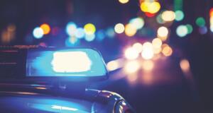 A photo of a blue light on top of a police vehicle.