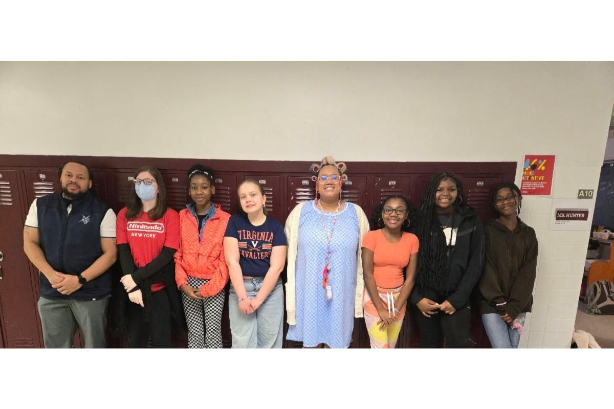 Shelburne Middle School students who are competing in National Civics Bee standing in front of lockers.