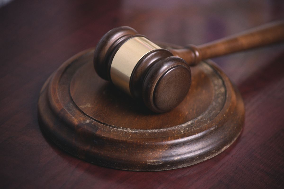 A gavel sits on a desk.