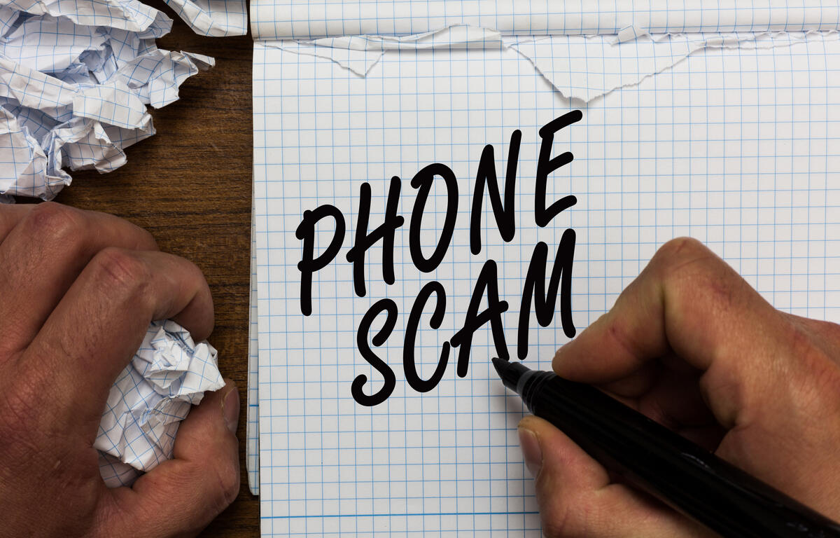 Text sign showing Phone Scam. Conceptual photo getting unwanted calls to promote products or service Telesales Man holding marker notebook crumpled papers ripped pages mistakes made