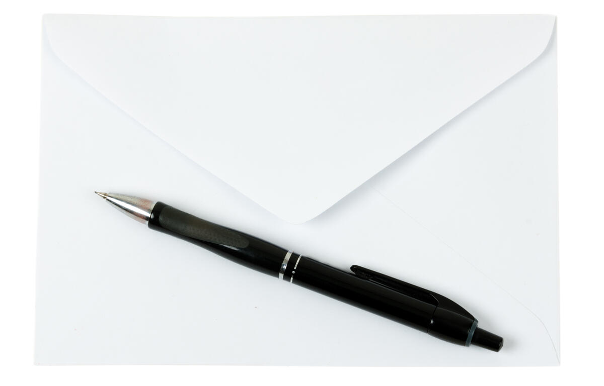 pencil on a blank envelope isolated on a white background
