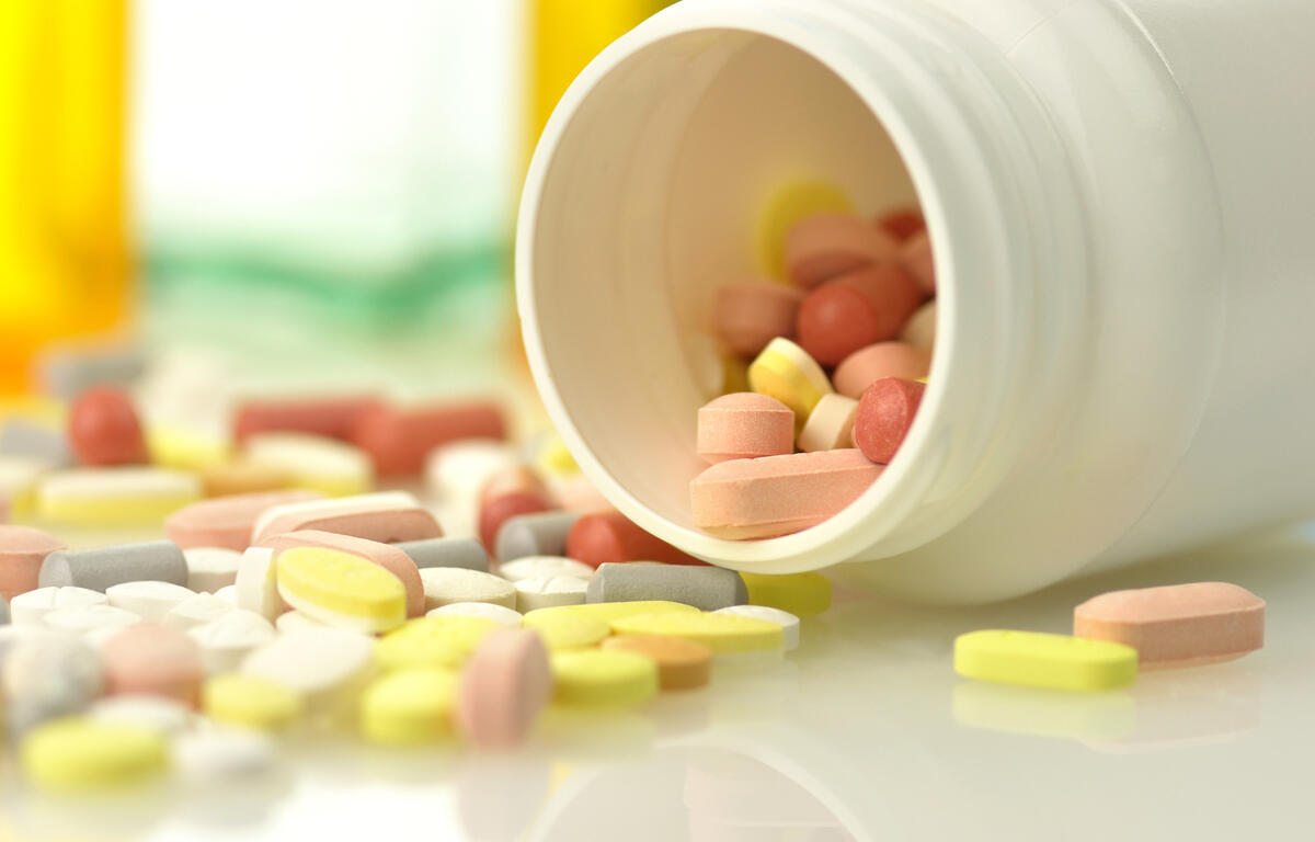 Medicine bottles and pills close up
