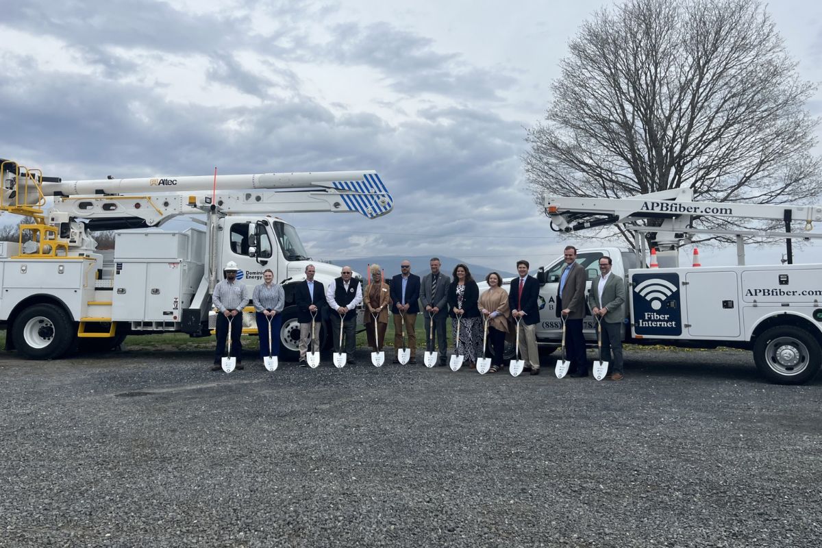 All Point Broadband Groundbreaking Ceremony - Members with shovels standing in front of trucks