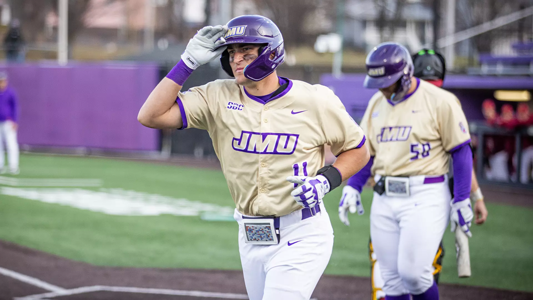 James Madison senior Coleman Calabrese walking to the plate