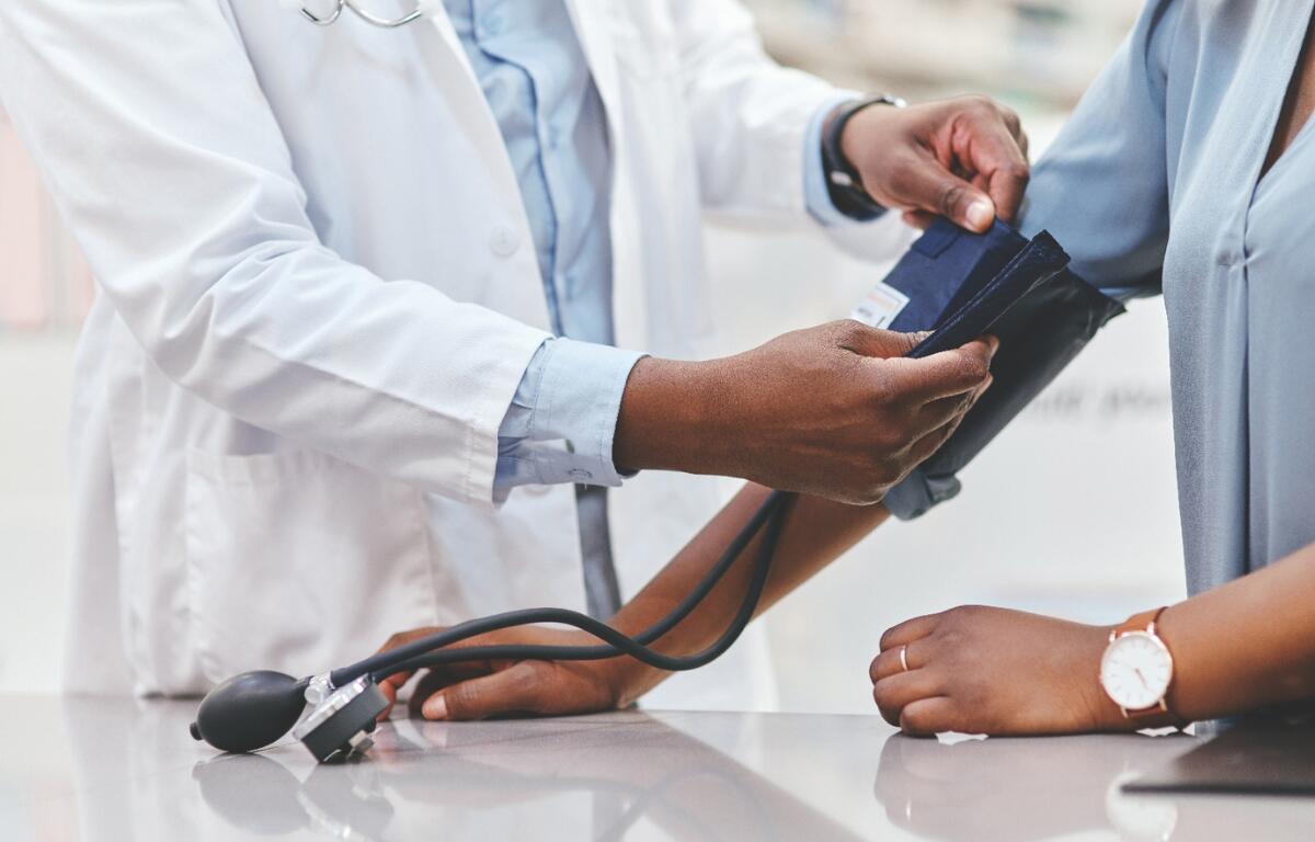 A patient getting their blood pressure taken.