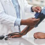 A patient getting their blood pressure taken.