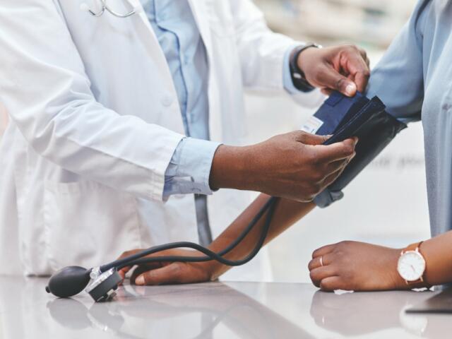 A patient getting their blood pressure taken.
