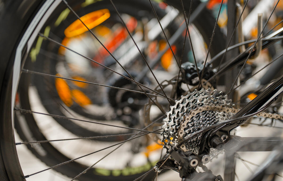 Mountain cycle in sports shop, focus on rear wheel