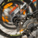 Mountain cycle in sports shop, focus on rear wheel