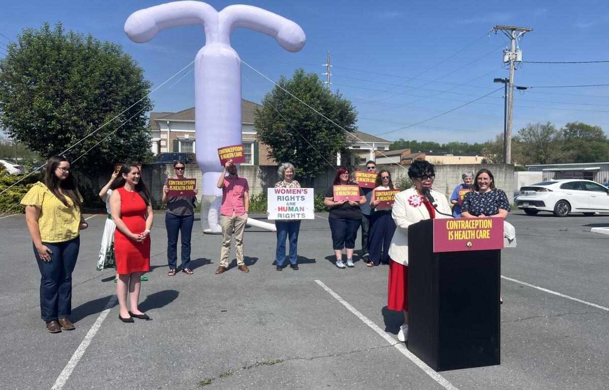 Mayor Deanna Reed speaking with supporters in the background