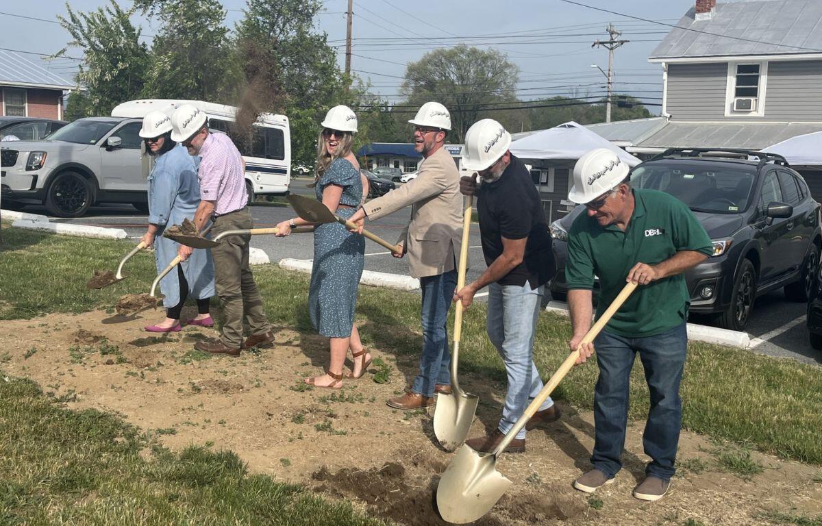 New Creation co-founders and partners breaking ground with shovels