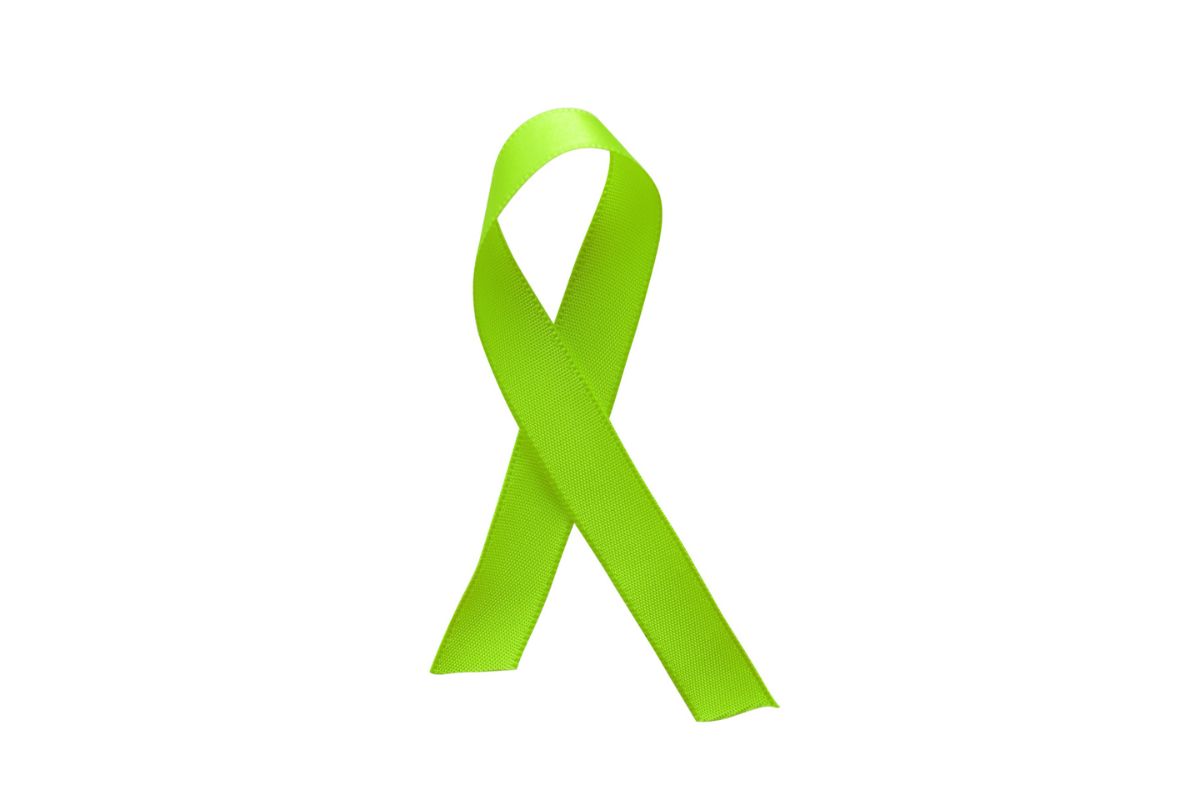 Green ribbon awareness isolated on white background