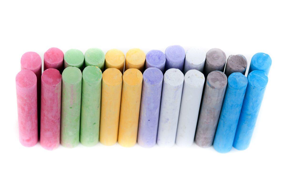 box with children's crayons on a white background.