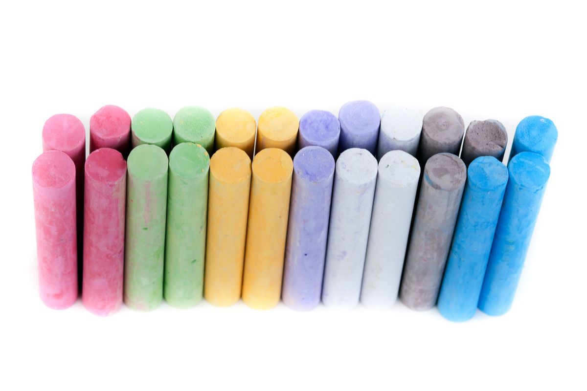 box with children's crayons on a white background.