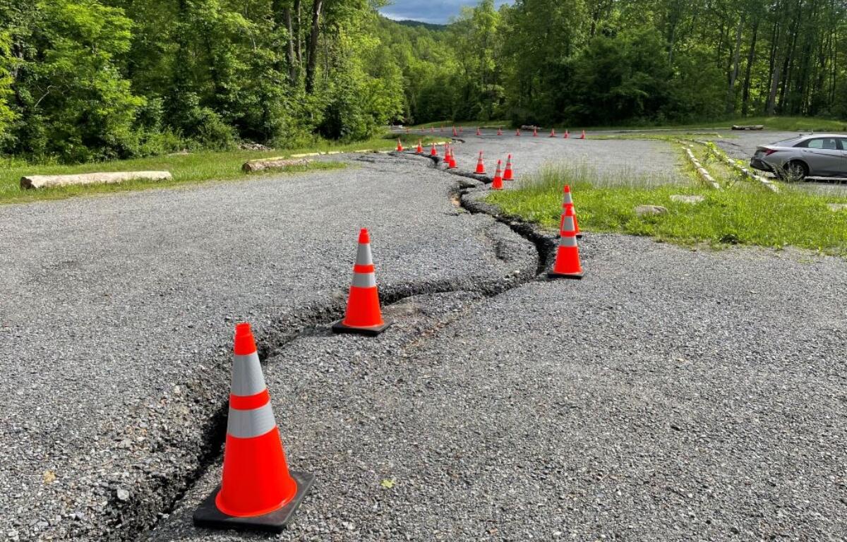 The Old Rag main parking lot with orange cones outlining the biggest ruts in the concrete.