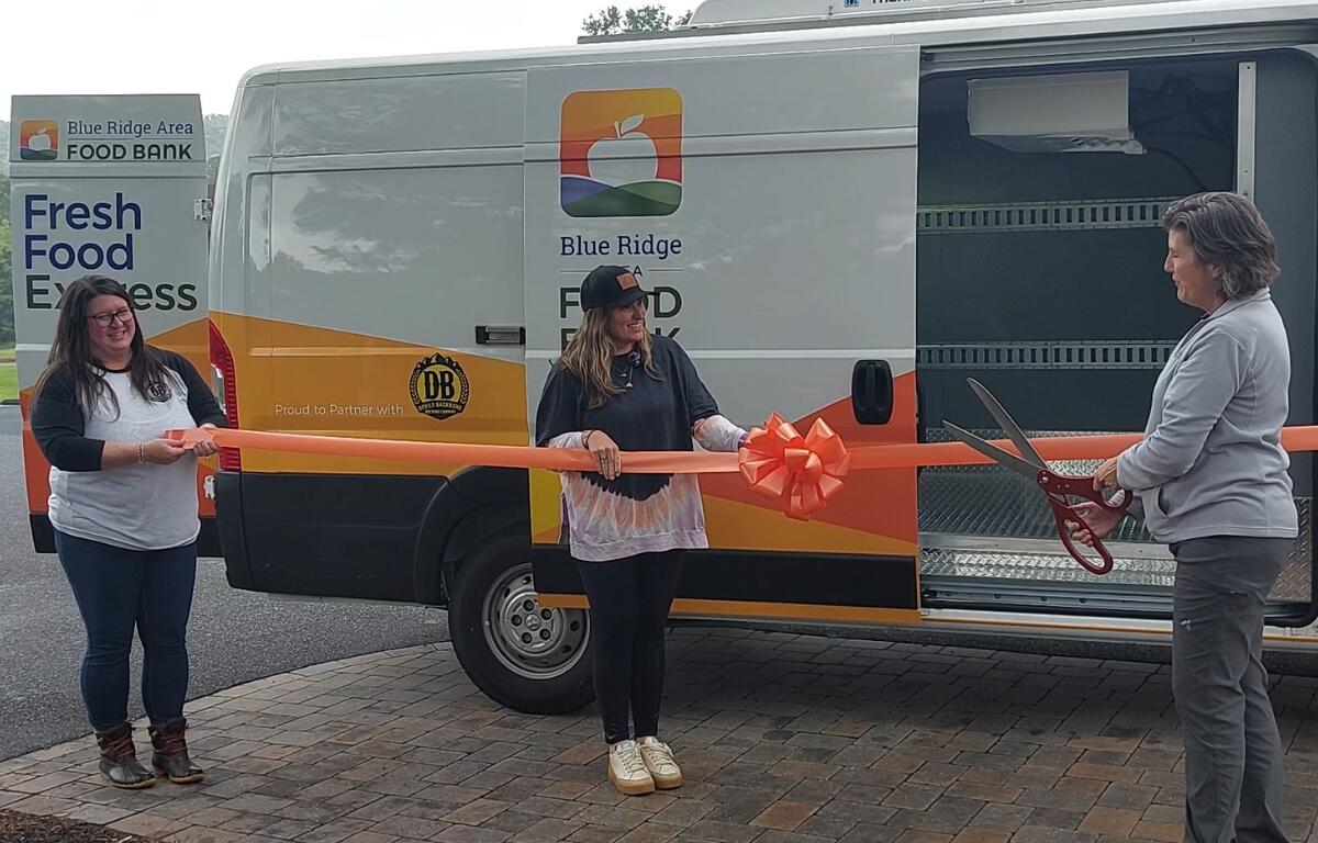 Megan Tuttle, Devils Backbone Chief Operating Officer and Karen Ratzlaff, Blue Ridge Area Food Bank Chief Philanthropy Officer cut the ribbon for the new van.