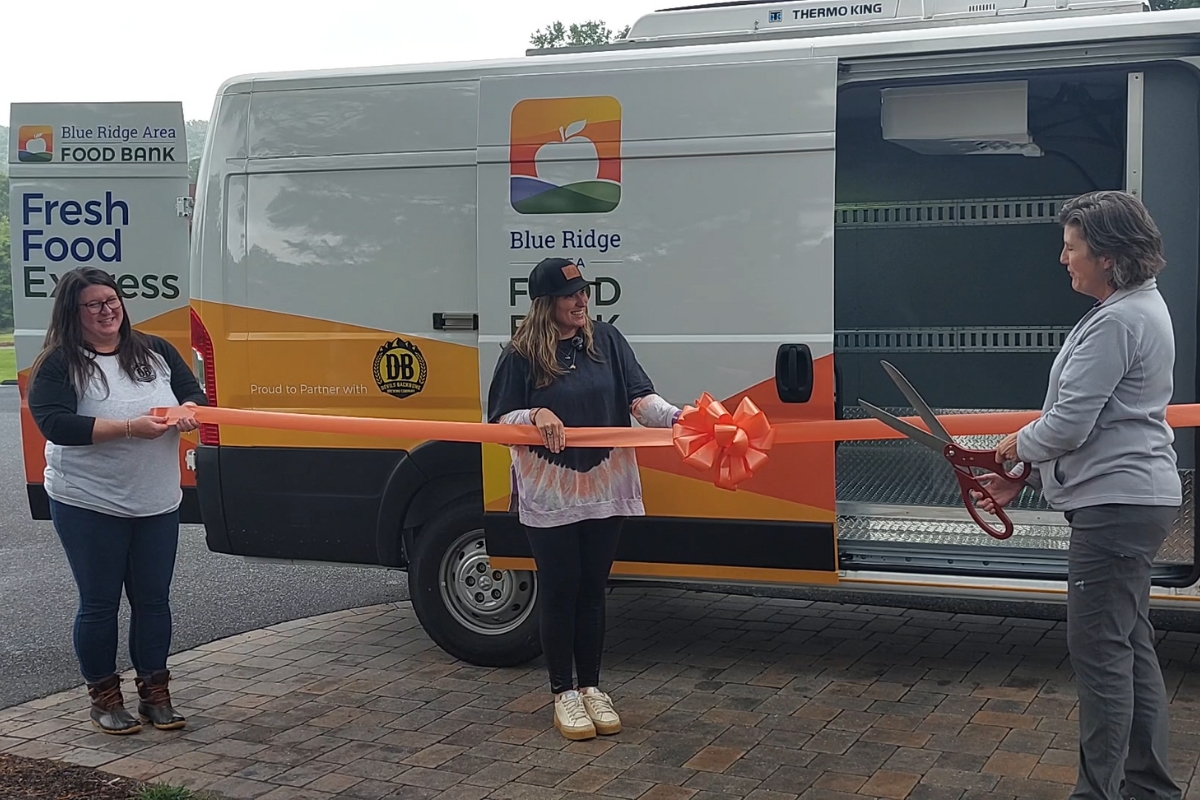 Megan Tuttle, Devils Backbone Chief Operating Officer and Karen Ratzlaff, Blue Ridge Area Food Bank Chief Philanthropy Officer cut the ribbon for the new van.