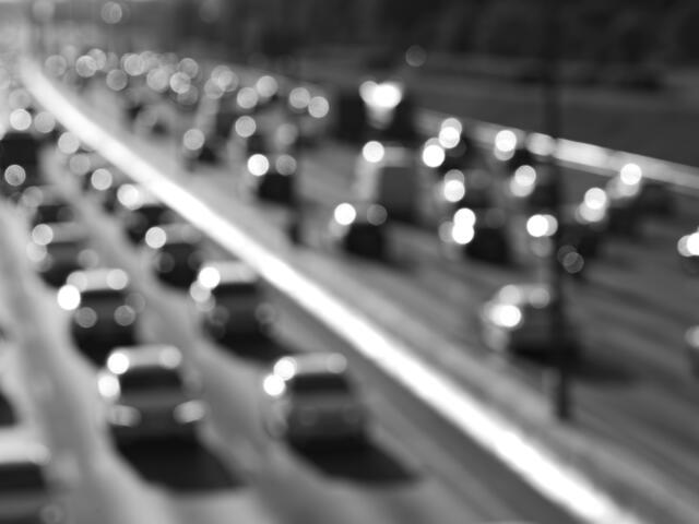 Black and white highway car traffic bokeh background