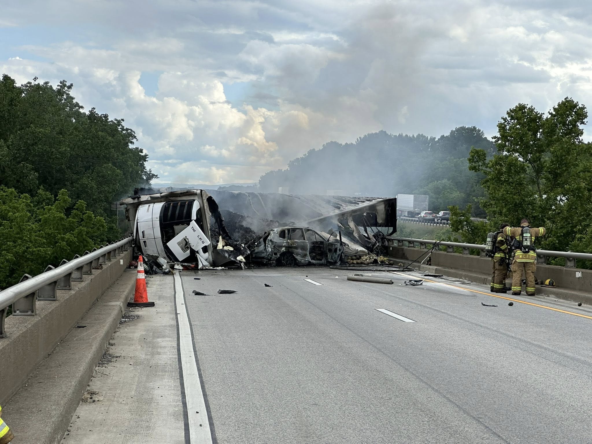 Tractor trailer overturns, catching fire and sending driver into river ...