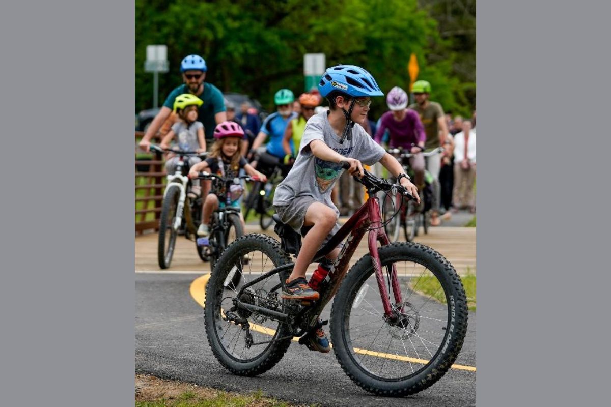 A family bicycles on a trail in Harrisonburg. The Harrisonburg Happy - Family Friendly Travel campaign highlights things families can do when visiting Harrisonburg