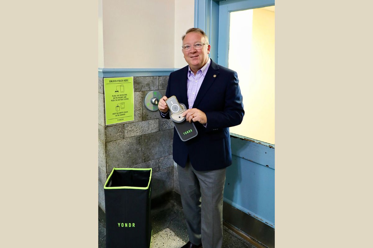 Clerk of Court Chaz W. Haywood holding Yondr pouch