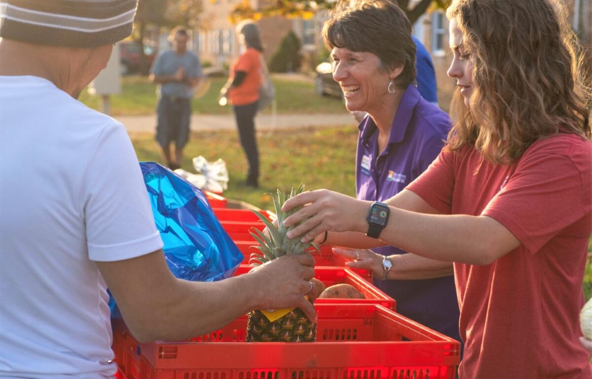 Blue Ridge Area Food Bank employees and volunteers handing out food.