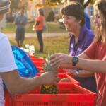 Blue Ridge Area Food Bank employees and volunteers handing out food.