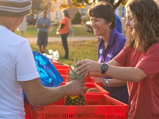 Blue Ridge Area Food Bank employees and volunteers handing out food.