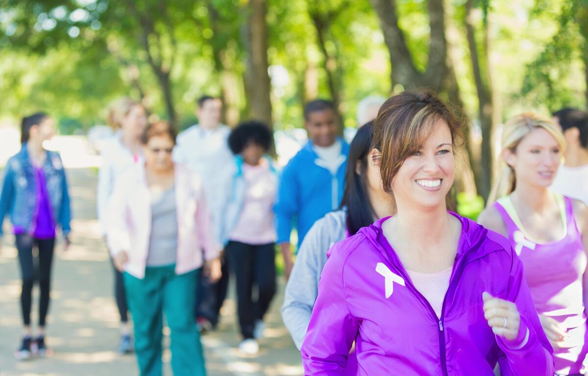 A group of people walking together in a park