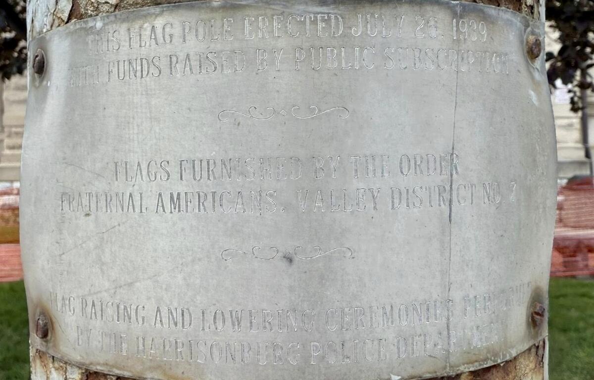 Up close of the plaque on the Rockingham County Flag Pole.