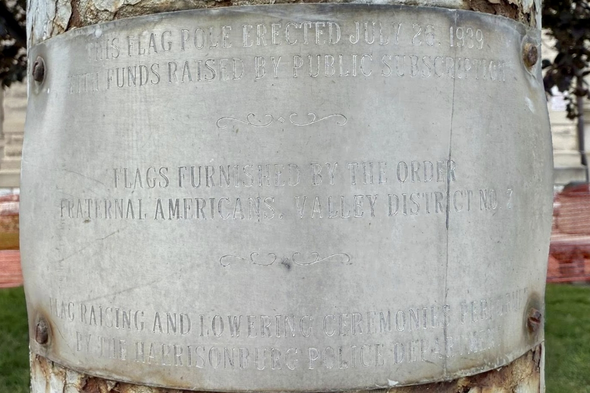 Up close of the plaque on the Rockingham County Flag Pole.