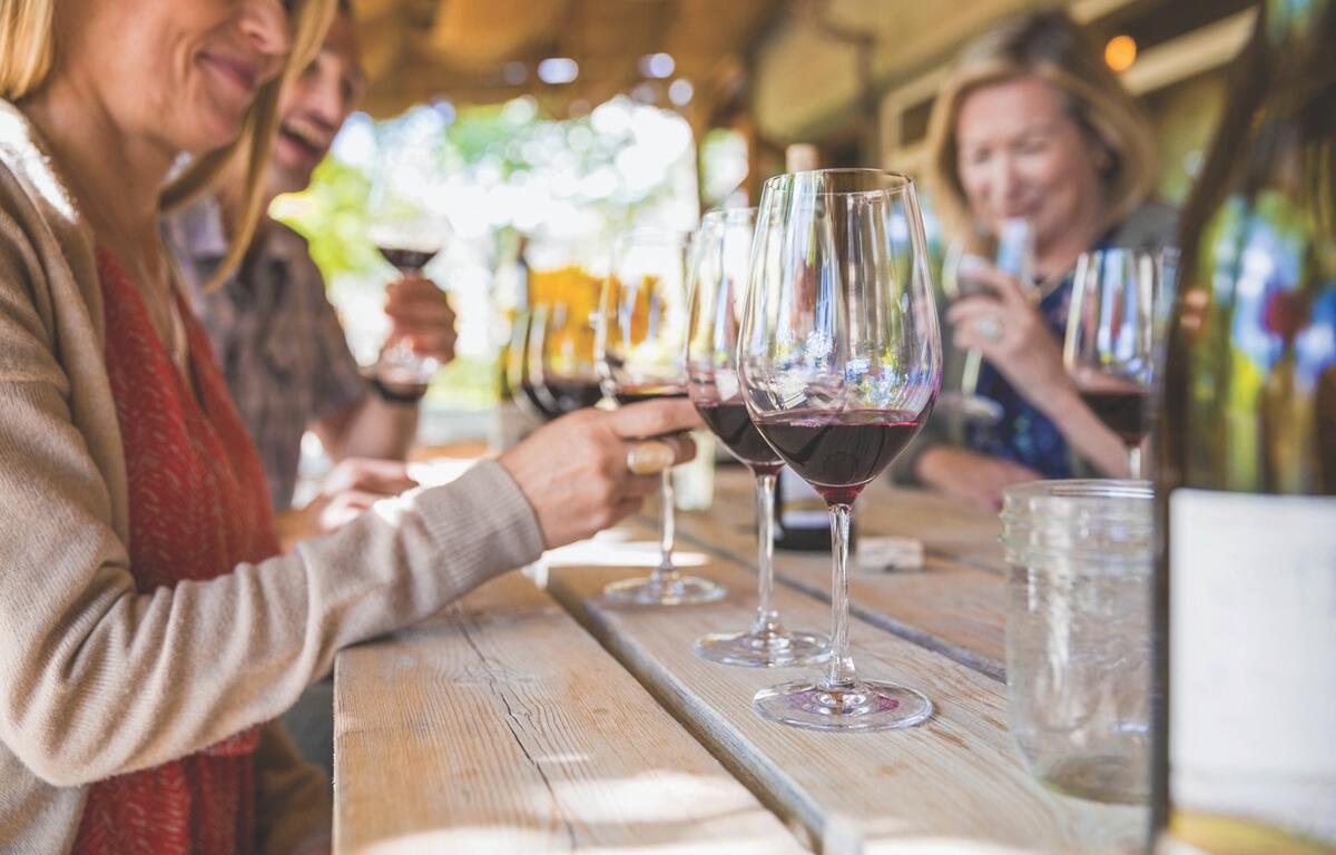 A group of people enjoying a wine tasting.