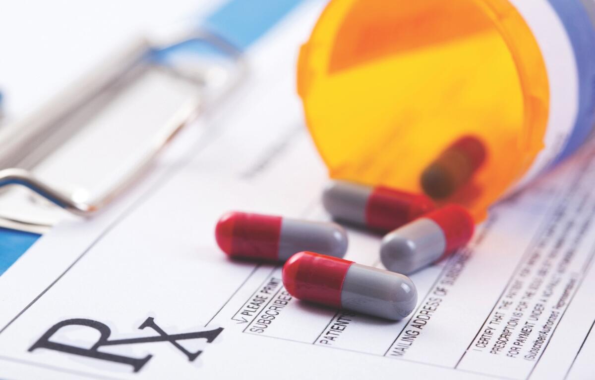 Pills laying on a prescription paper.