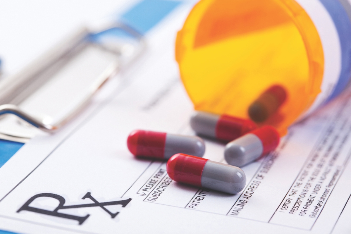 Pills laying on a prescription paper.