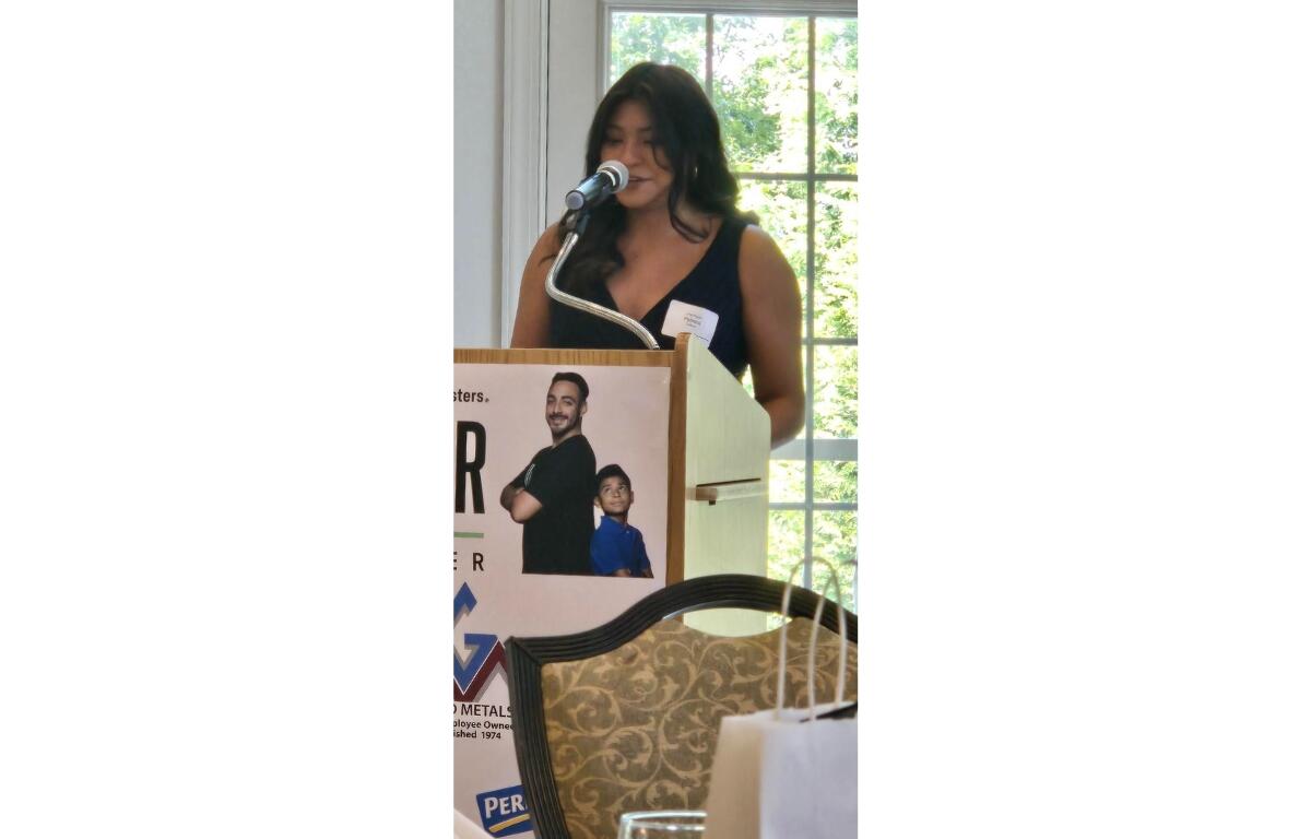 Paloma Hidalgo, a rising senior at Harrisonburg High School takes the podium.