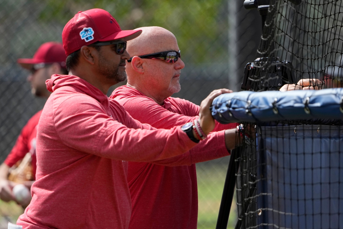 Washington Nationals manager Dave Martinez, left, watches with general manager Mike Rizzo during spring training baseball practice Saturday, Feb. 18, 2023, in West Palm Beach, Fla.