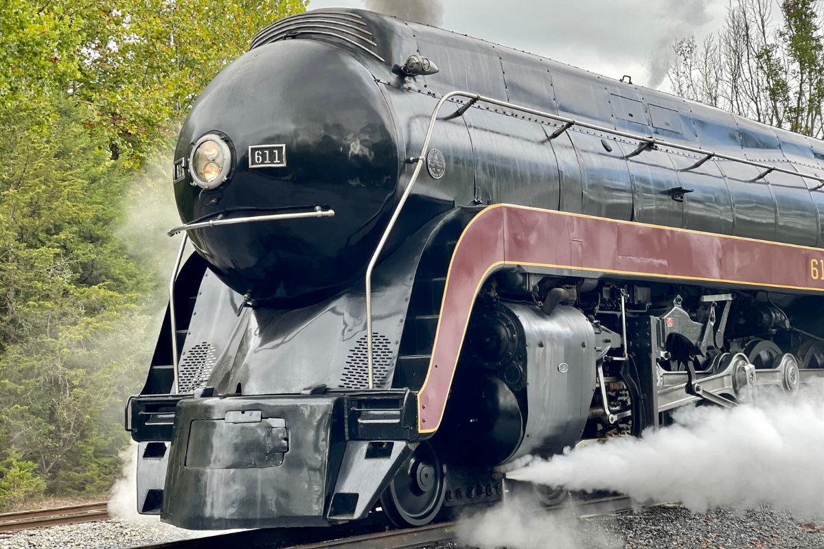 Up close of the 611 locomotive. A large black train.