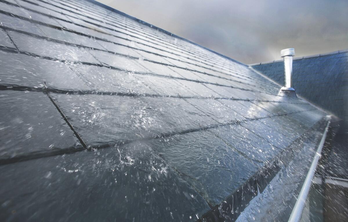 Heavy rain on a roof.